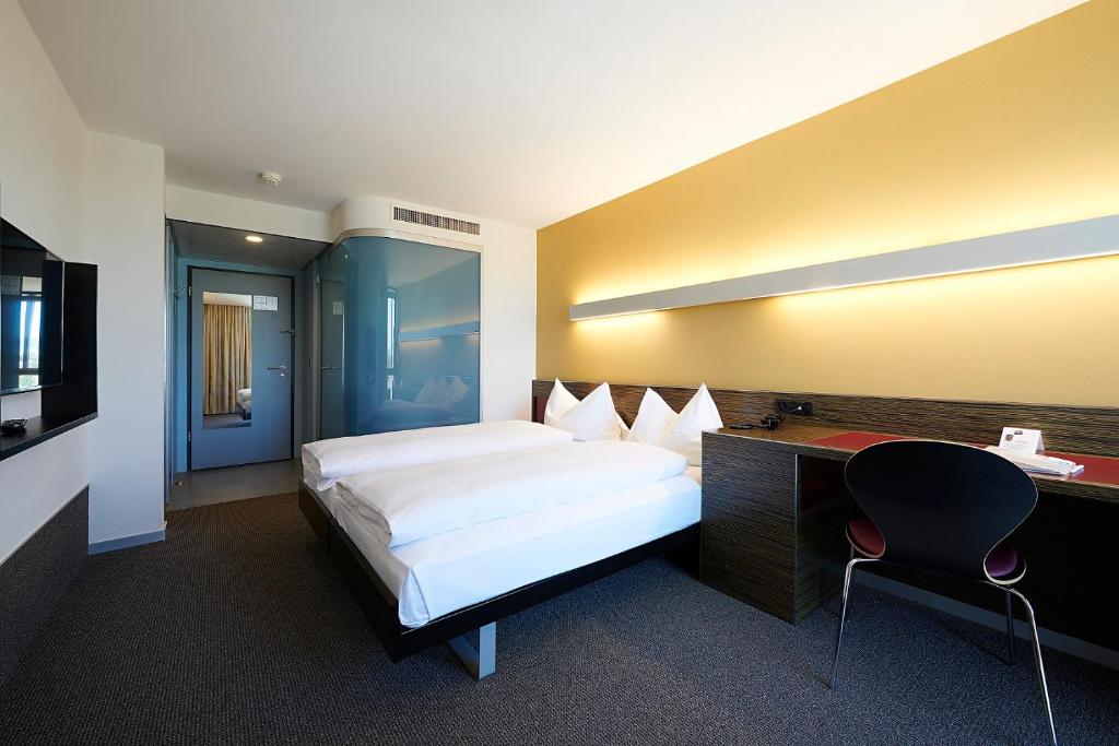 Postel nebo postele na pokoji v ubytování Hotel Ambassador