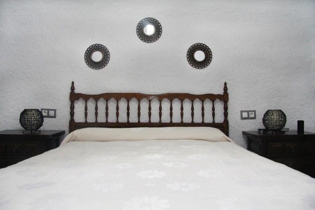 Postel nebo postele na pokoji v ubytování Cuevas Cañada de las Piedras