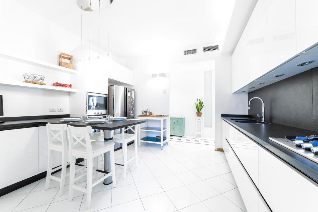 Kuchyňa alebo kuchynka v ubytovaní Loreto Elegant Flat