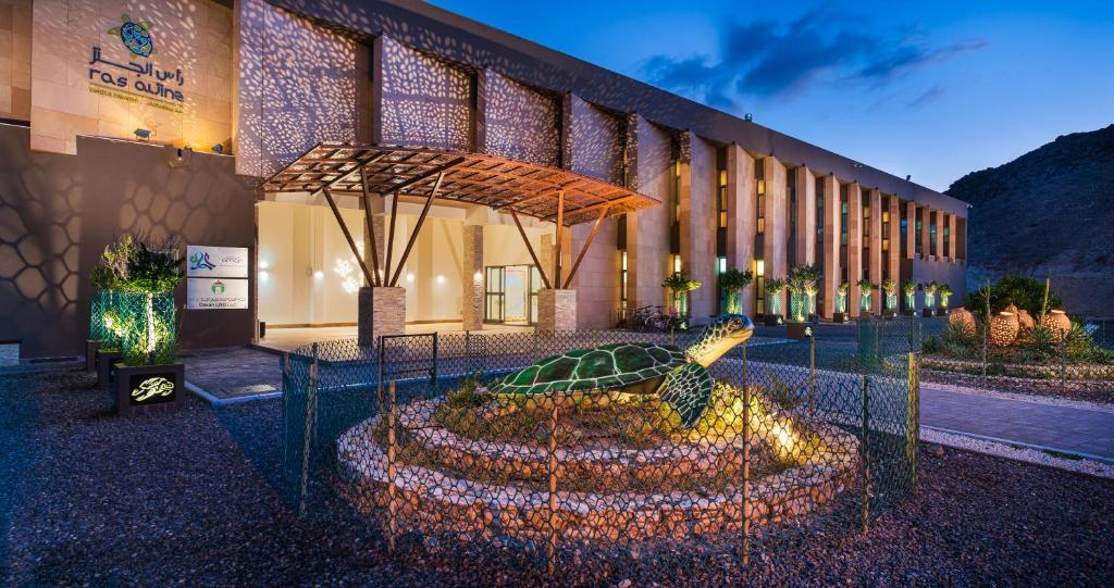 a building with a garden in front of it at Ras Al Jinz Turtle Reserve in Sur