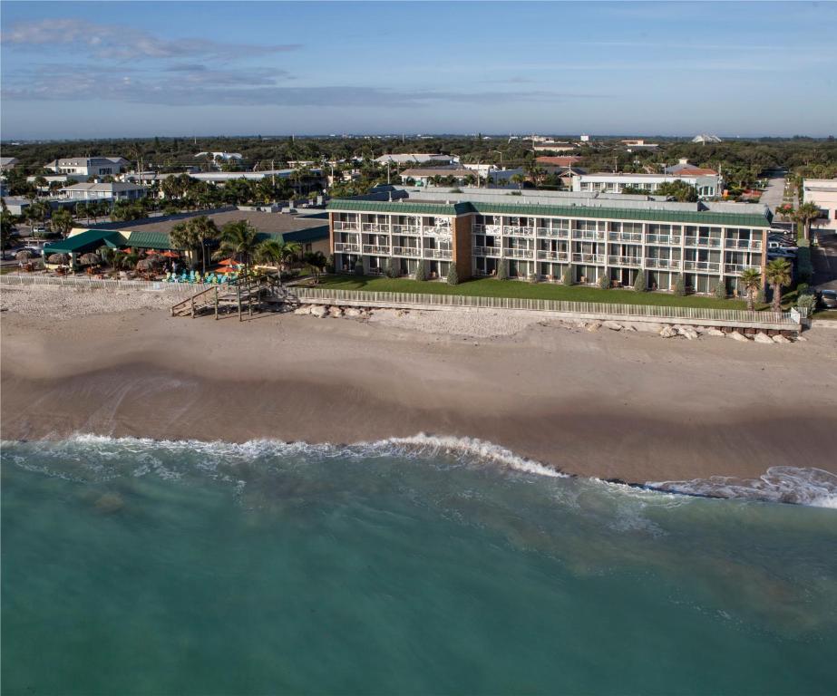 an aerial view of a hotel on the beach at Ocean Breeze Inn Vero Beach in Vero Beach