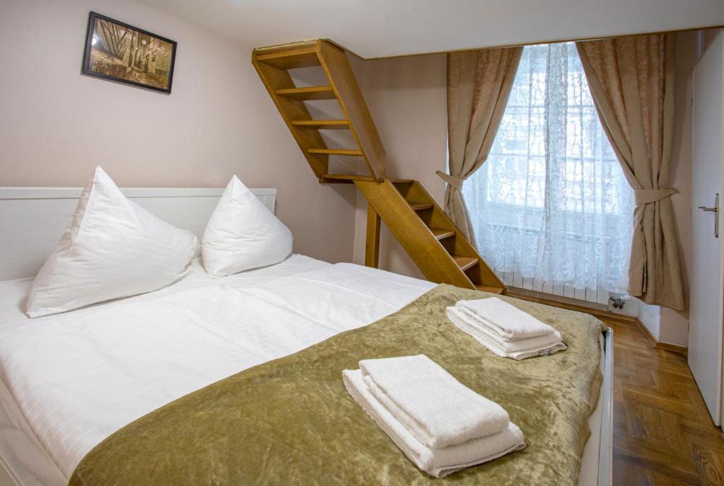 Postel nebo postele na pokoji v ubytování Michalska Apartment