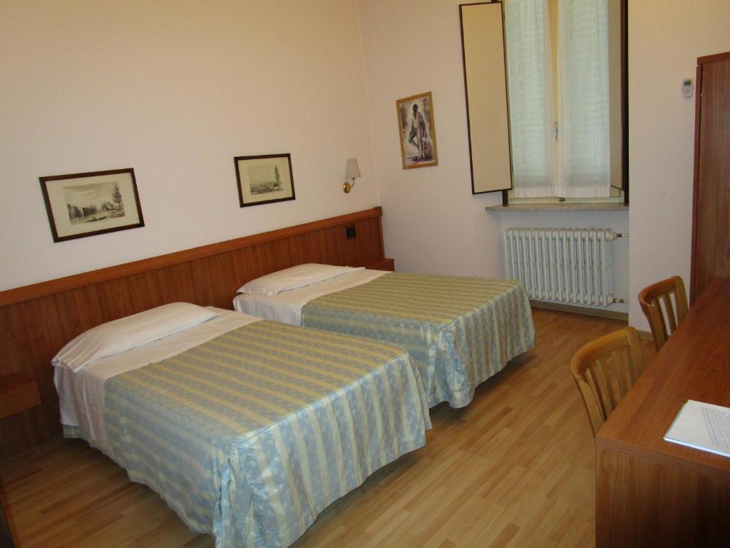 Posteľ alebo postele v izbe v ubytovaní Hotel San Marco