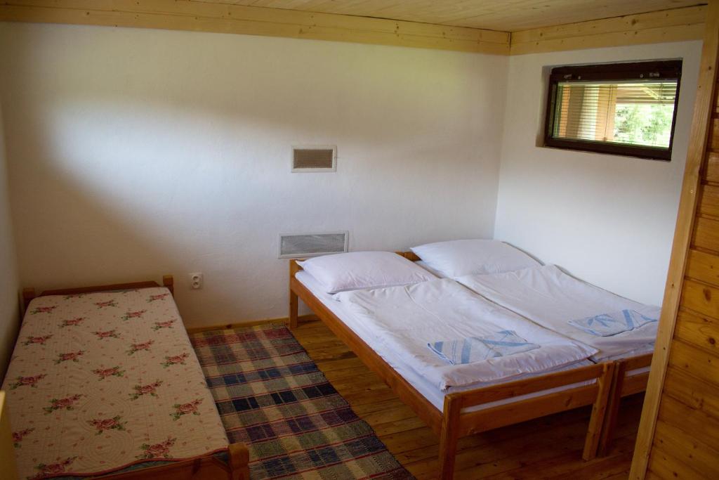 Postel nebo postele na pokoji v ubytování CHATA JURAJ