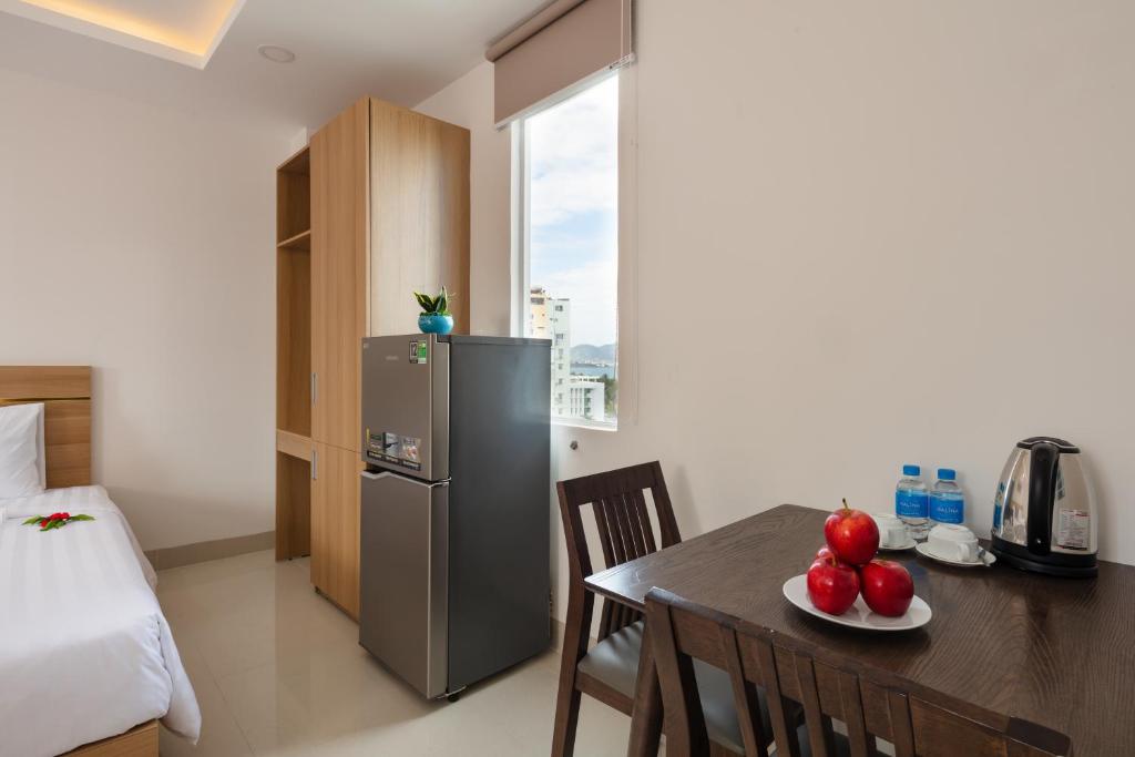 Giường trong phòng chung tại XO Hotel & Apartments