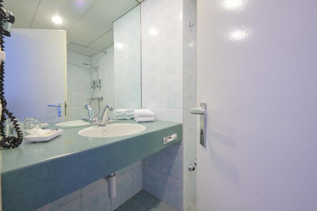 Koupelna v ubytování Hotel City am Bahnhof