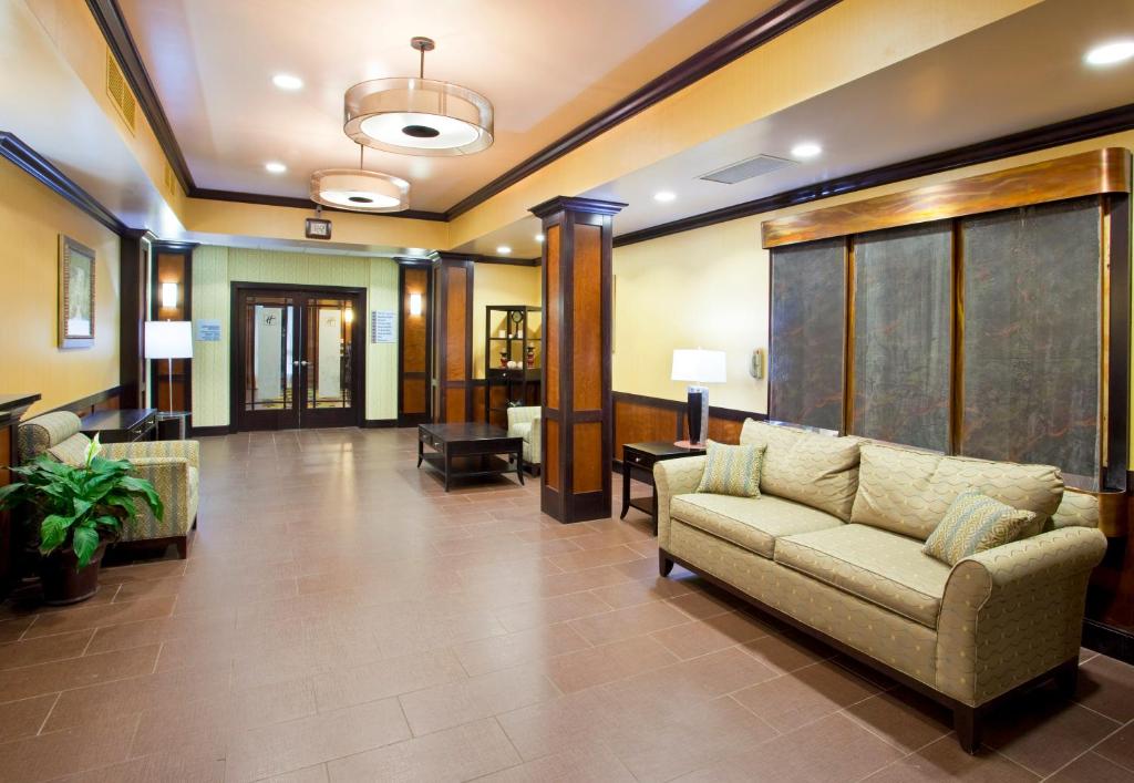 a living room with a couch in a lobby at Holiday Inn Express Hotel & Suites Van Wert, an IHG Hotel in Van Wert