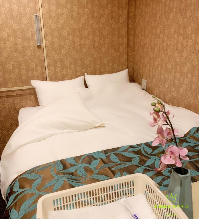 Posteľ alebo postele v izbe v ubytovaní Nishifunabashi Ekimae Hotel