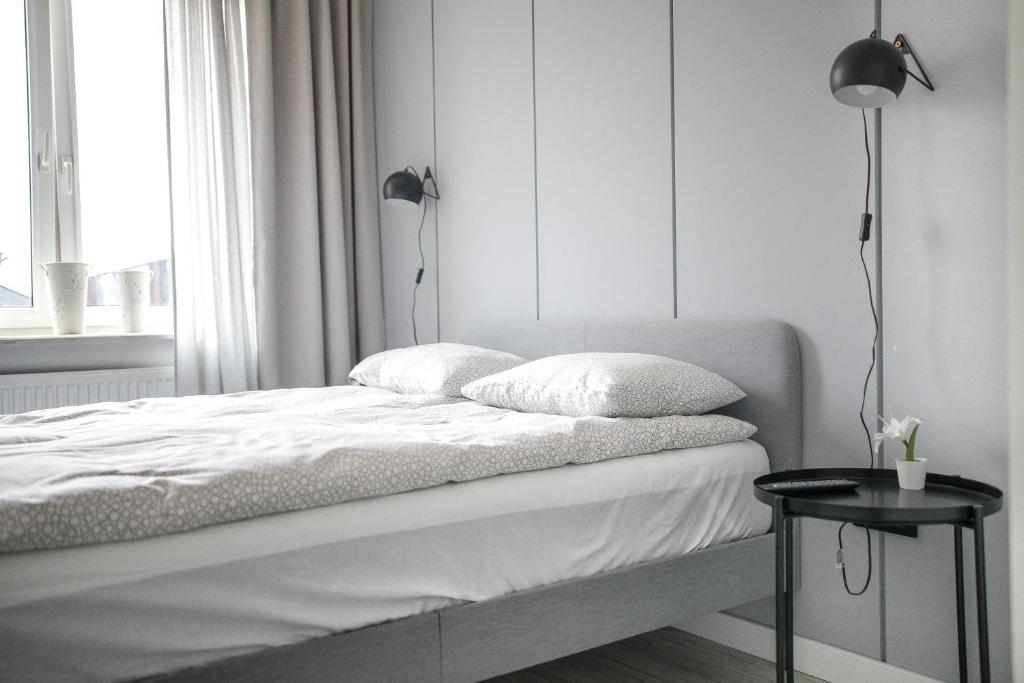 Posteľ alebo postele v izbe v ubytovaní Apartament Nadbystrzycka no.14