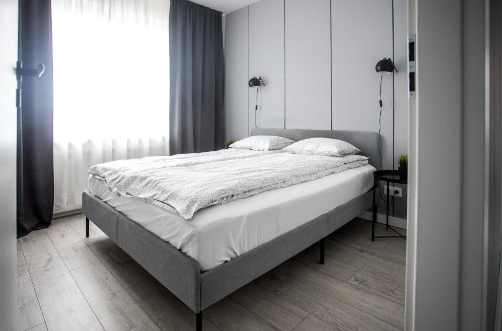 Posteľ alebo postele v izbe v ubytovaní Apartament Nadbystrzycka no.14