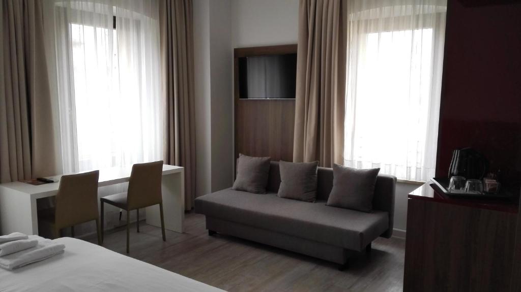 Posteľ alebo postele v izbe v ubytovaní Albergo Delle Alpi