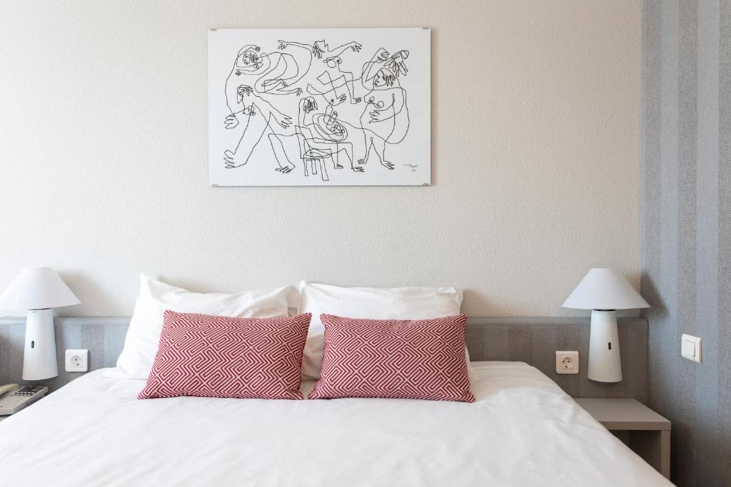 Postel nebo postele na pokoji v ubytování Ibis Valencia Alfafar