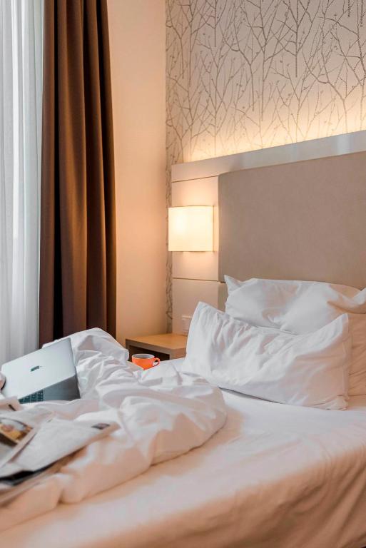 Postel nebo postele na pokoji v ubytování Boutique Hotel Atrium München