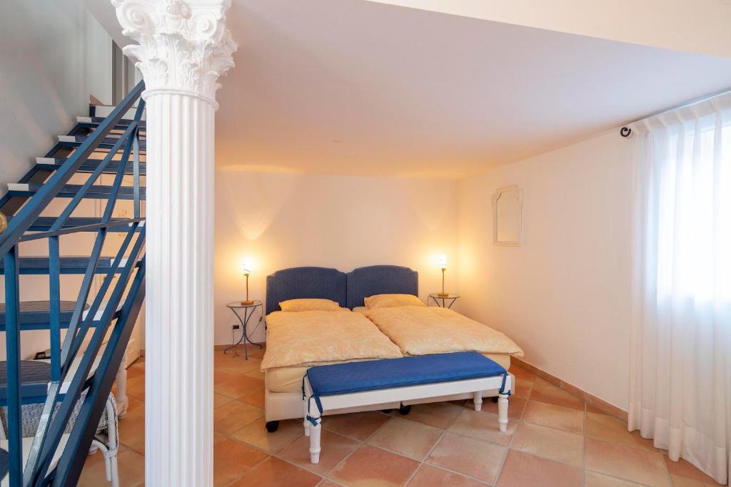 Postel nebo postele na pokoji v ubytování Hotel al Ponte Antico