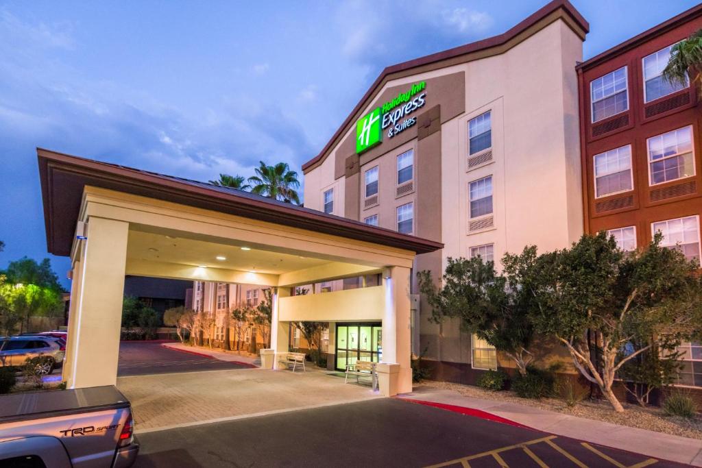 a large building with a sign on the side of it at Holiday Inn Express Phoenix-Airport/University Drive, an IHG Hotel in Phoenix