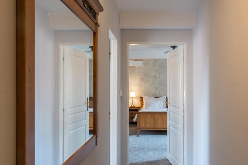 a hallway with a door leading to a bedroom at Monastery Garden Prague in Prague