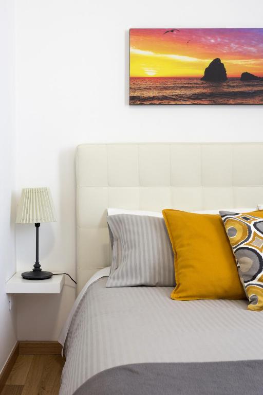 Posteľ alebo postele v izbe v ubytovaní Centre Apartment Grotte Bianche