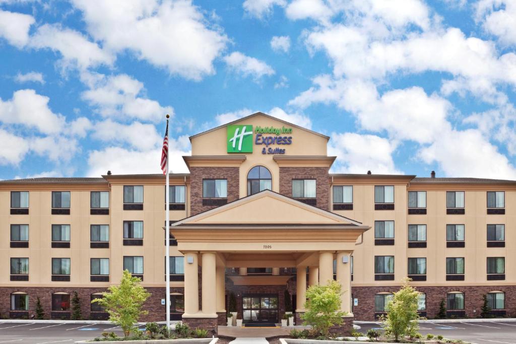 a hotel building with a sign on top of it at Holiday Inn Express Hotel & Suites Vancouver Mall-Portland Area, an IHG Hotel in Vancouver