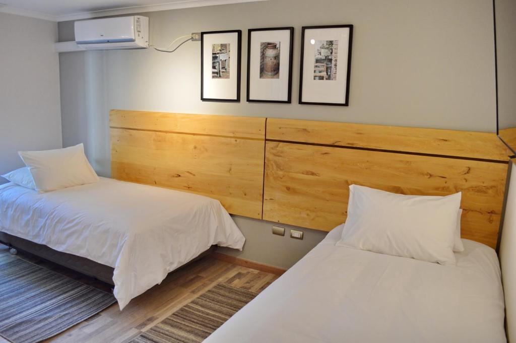 Postel nebo postele na pokoji v ubytování Hotel Cinco Tierras