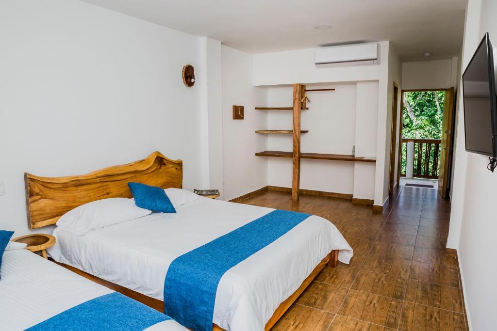 Postel nebo postele na pokoji v ubytování Hotel Restaurante Selva Negra