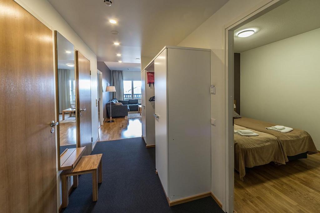 Кровать или кровати в номере Ruka Chalets Ski-Inn