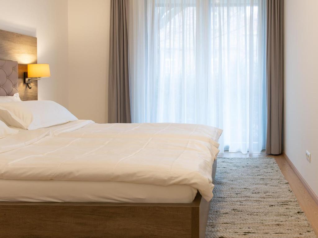 Ein Bett oder Betten in einem Zimmer der Unterkunft Premium Green Apartments Vienna