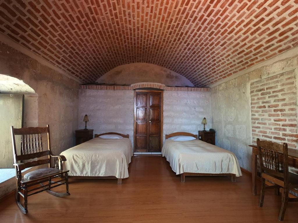 Postel nebo postele na pokoji v ubytování La Casa de Melgar