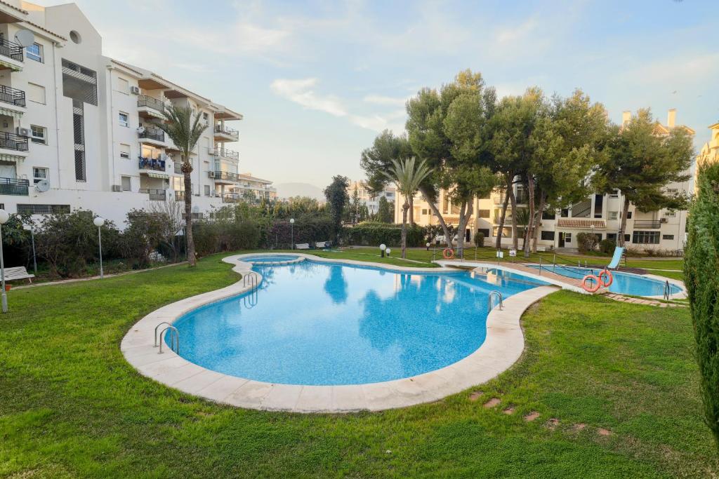 an image of a swimming pool in a park at Apartamentos BCL Playa Albir in Albir