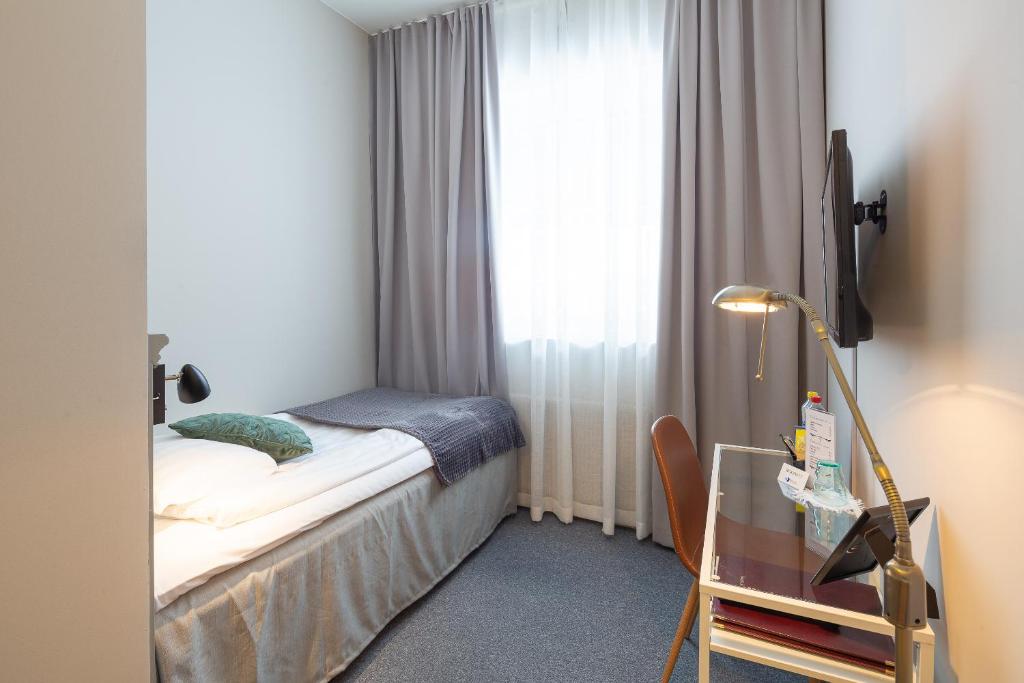 Postel nebo postele na pokoji v ubytování Hotell Leksand