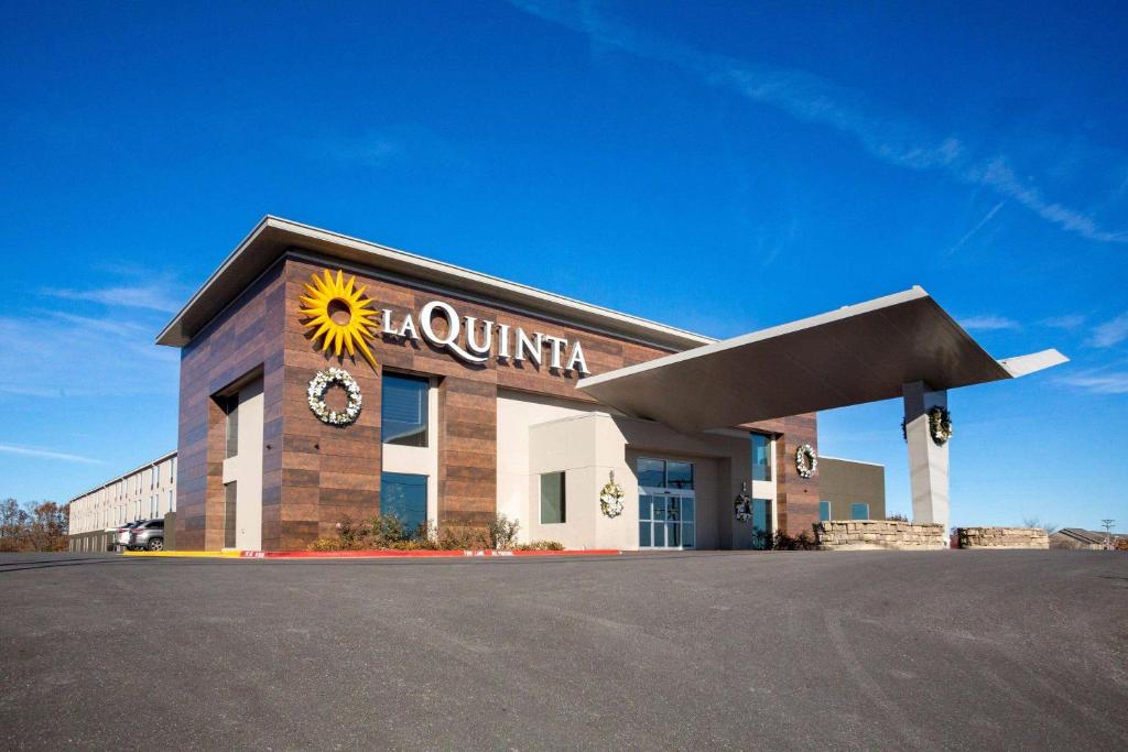 a building with a sunflower on the front of it at La Quinta by Wyndham Branson in Branson