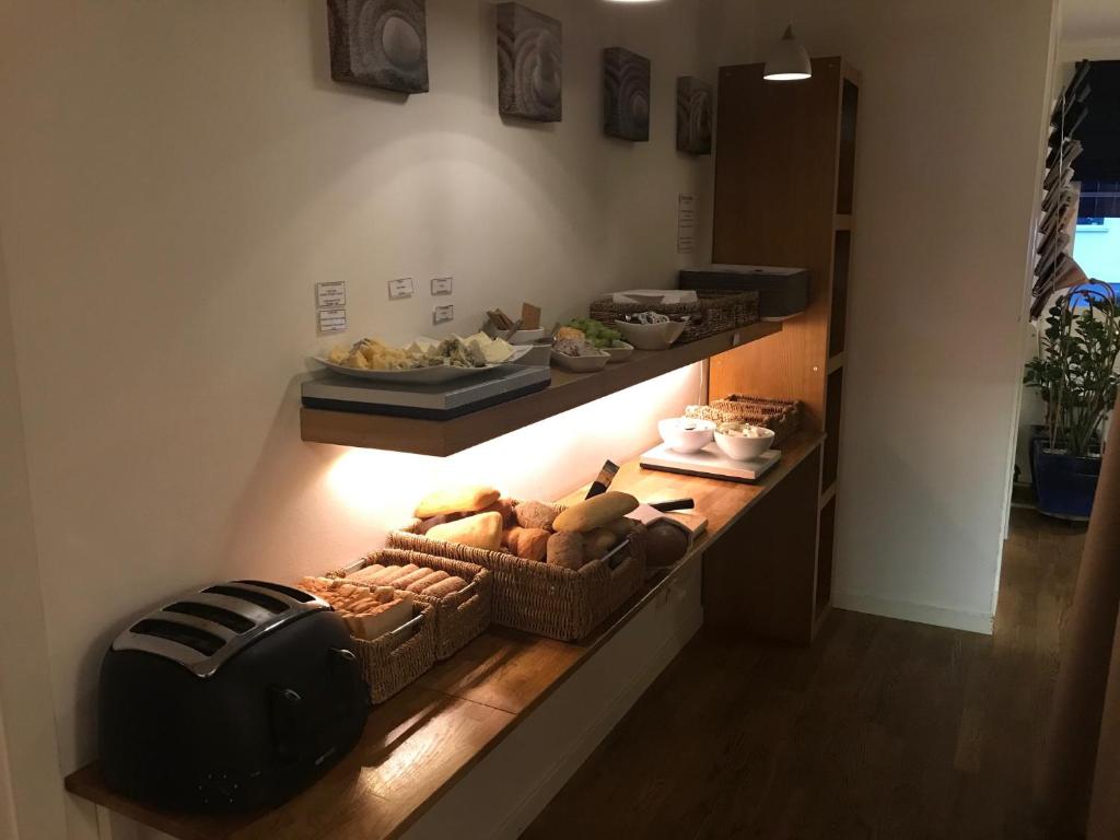 Kuchyň nebo kuchyňský kout v ubytování Port Hotel Apartments