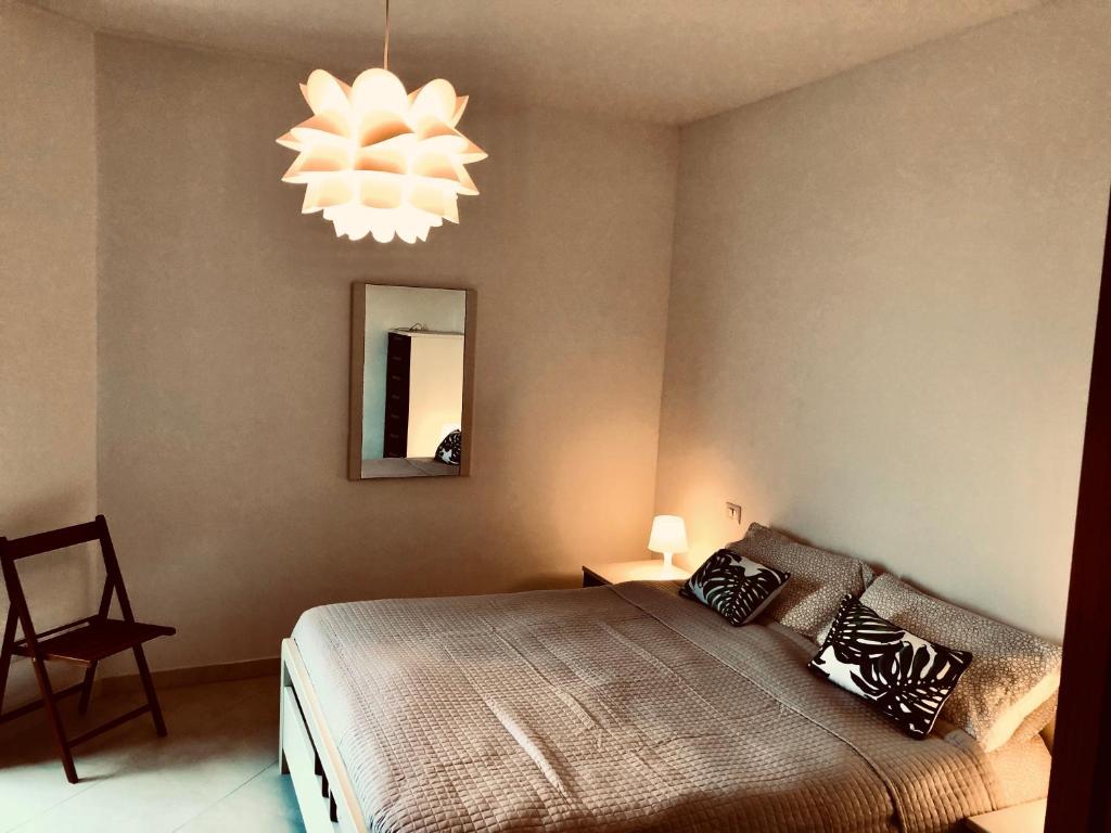 A bed or beds in a room at Appartamento a Corte Balai
