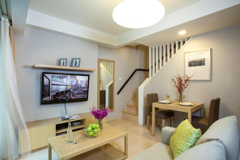 TV a/nebo společenská místnost v ubytování Citadines Zhuankou Wuhan