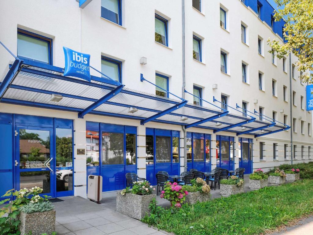 an exterior view of the front of a building at ibis budget Karlsruhe in Karlsruhe