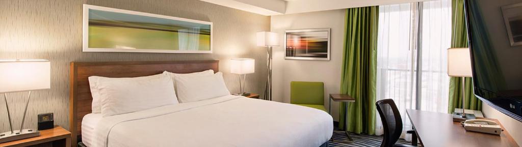 Voodi või voodid majutusasutuse Holiday Inn Winnipeg - Airport West, an IHG Hotel toas