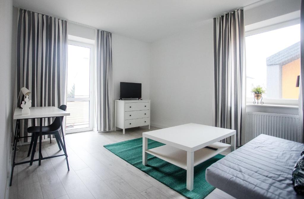 Televízia a/alebo spoločenská miestnosť v ubytovaní Apartament Nadbystrzycka no.14