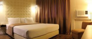 Postel nebo postele na pokoji v ubytování Rothman Hotel
