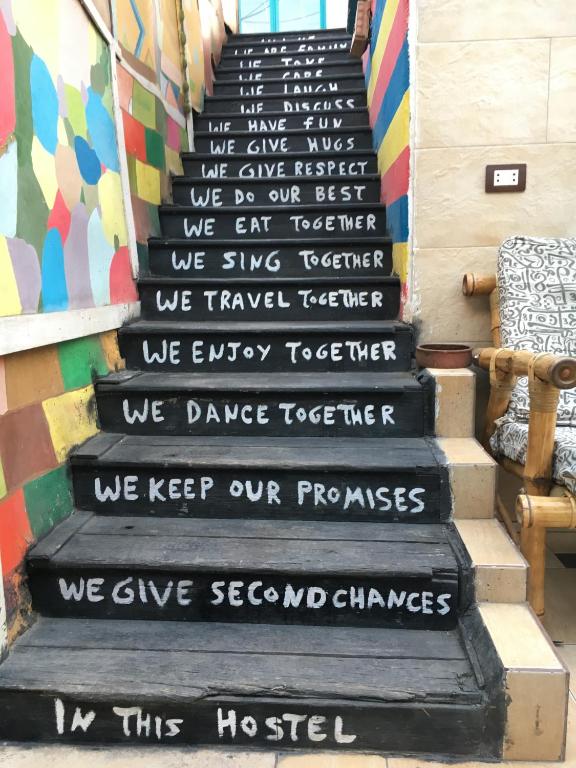 a stairwell with a poem written on it at Dahab Hostel in Cairo