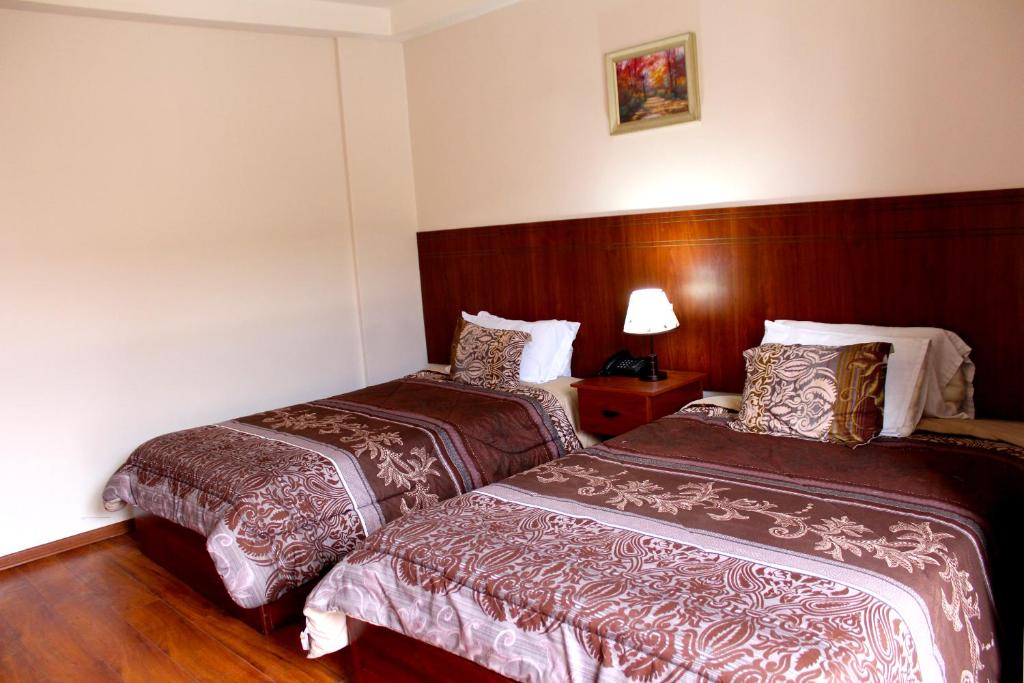 Postel nebo postele na pokoji v ubytování Rio Hotel