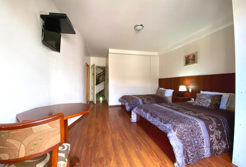 Postel nebo postele na pokoji v ubytování Rio Hotel