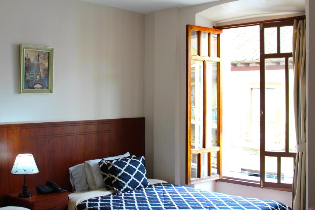 Postel nebo postele na pokoji v ubytování Rio Hotel