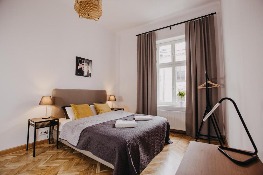 Postel nebo postele na pokoji v ubytování Michałowskiego 11