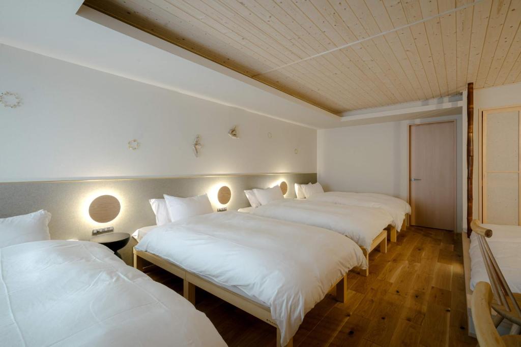 Postel nebo postele na pokoji v ubytování so, KANAZAWA