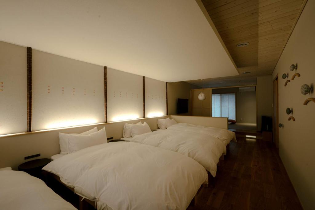 Postel nebo postele na pokoji v ubytování so, KANAZAWA