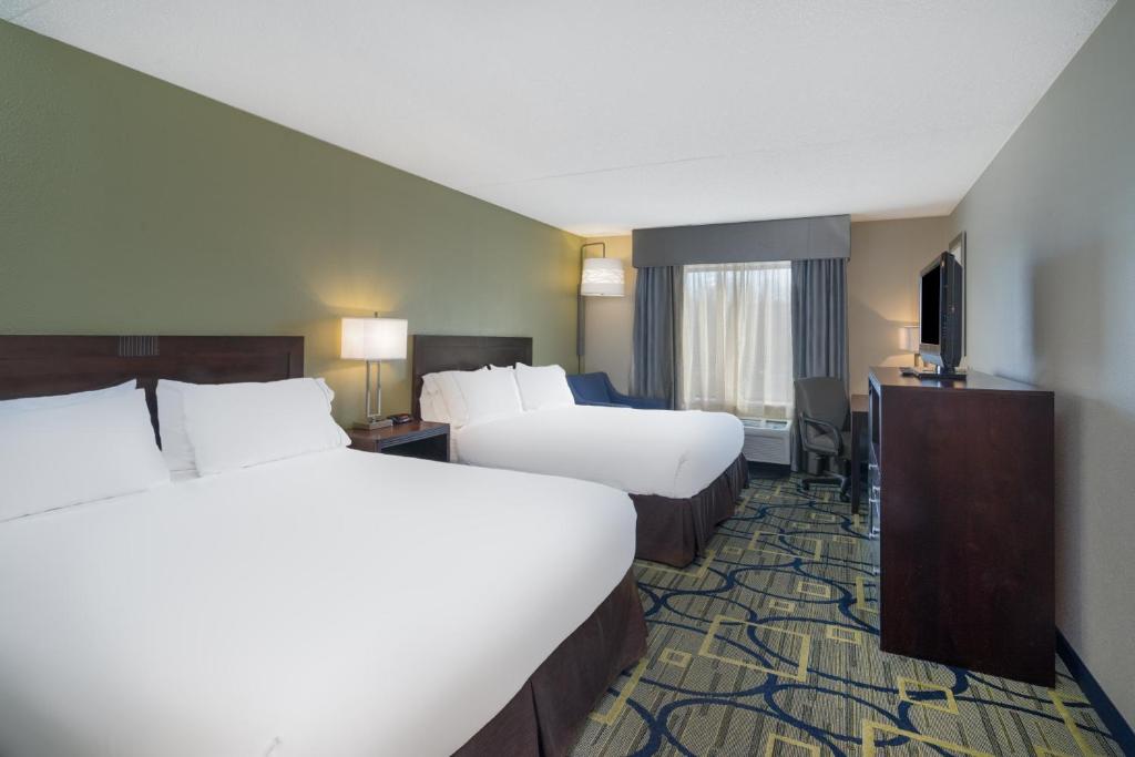 a hotel room with two beds and a television at Holiday Inn Express Hotel & Suites Easton by IHG in Easton