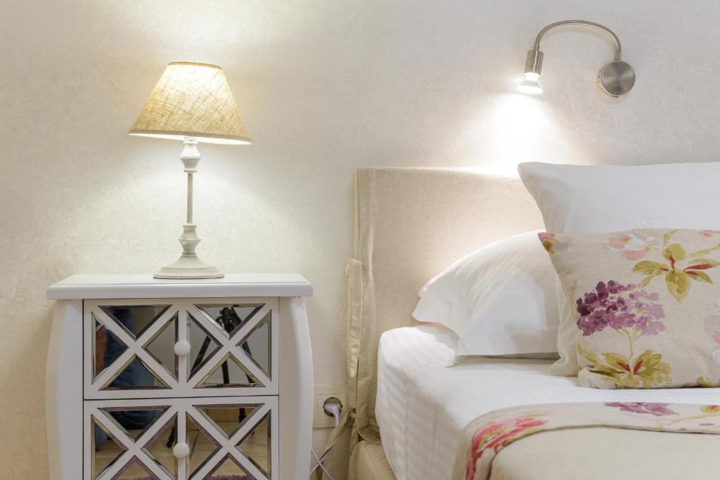 Un ou plusieurs lits dans un hébergement de l'établissement Guest House Flores