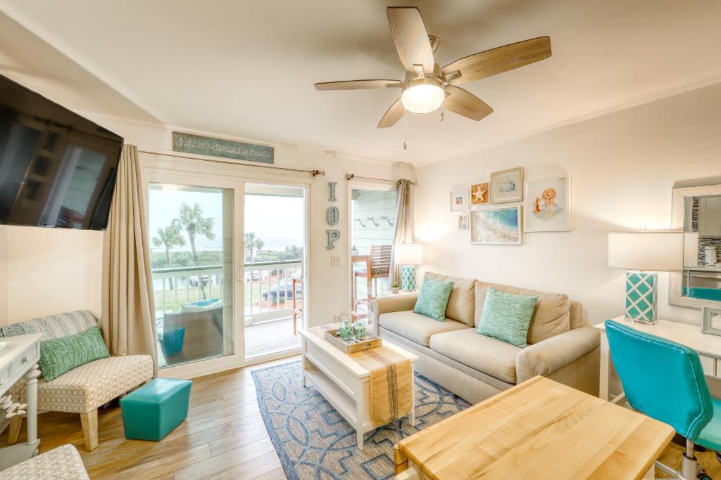 a living room with a couch and a table at Sea Cabin 232-C in Isle of Palms