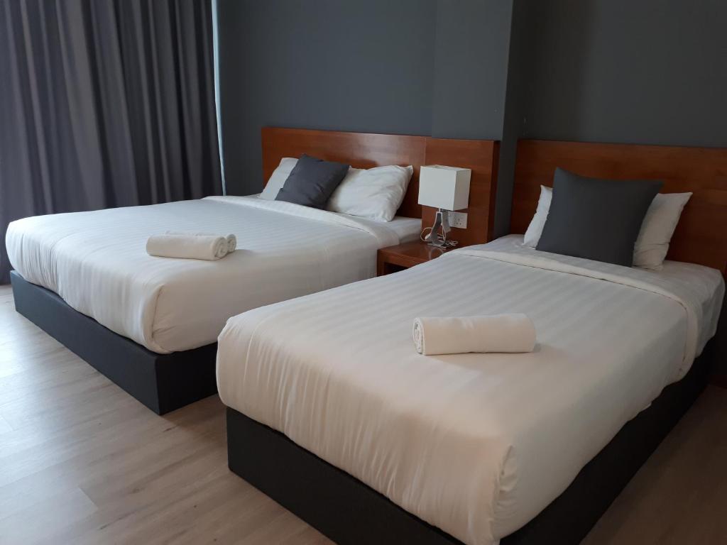 Postel nebo postele na pokoji v ubytování Hotin Inn