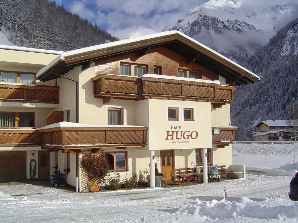 a large building with a hilo sign in front of it at Haus Hugo in Sölden