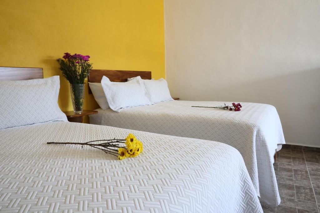 Postel nebo postele na pokoji v ubytování Hotel Del Mar